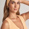 Bandă pentru păr din modal cu nervuri, model Candy, în nuanța piersică Bandă pentru păr din modal cu nervuri, model Candy, în nuanța piersică