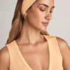 Bandă pentru păr din modal cu nervuri, model Candy, în nuanța piersică Bandă pentru păr din modal cu nervuri, model Candy, în nuanța piersică