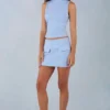 Bluză cu guler înalt din imitație de piele de căprioară Aurelle, de culoare albastru deschis Bluză cu guler înalt din imitație de piele de căprioară Aurelle, de culoare albastru deschis