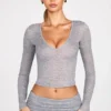 Bluză cu mâneci lungi și decolteu adânc din jersey transparent Liah, în culoarea gri Bluză cu mâneci lungi și decolteu adânc din jersey transparent Liah, în culoarea gri