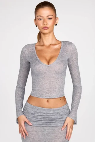 Bluză cu mâneci lungi și decolteu adânc din jersey transparent Liah, în culoarea gri Bluză cu mâneci lungi și decolteu adânc din jersey transparent Liah, în culoarea gri