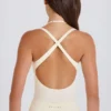 Body-ul din jersey de bumbac elastic, cu spate încrucișat, în nuanța crem Body-ul din jersey de bumbac elastic, cu spate încrucișat, în nuanța crem