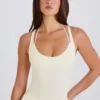 Body-ul din jersey de bumbac elastic, cu spate încrucișat, în nuanța crem Body-ul din jersey de bumbac elastic, cu spate încrucișat, în nuanța crem