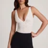 Body Zayla din dantelă transparentă cu decolteu adânc și margini festonate, în culoarea albă Body Zayla din dantelă transparentă cu decolteu adânc și margini festonate, în culoarea albă