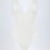 Body Zayla din dantelă transparentă cu decolteu adânc și margini festonate, în culoarea albă Body Zayla din dantelă transparentă cu decolteu adânc și margini festonate, în culoarea albă