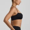 Braletă Jerika din jersey elastic cu detalii metalice și gât halter, în negru Braletă Jerika din jersey elastic cu detalii metalice și gât halter, în negru
