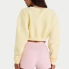 Cardigan scurt din jersey periat, cu nasturi, în galben deschis Cardigan scurt din jersey periat, cu nasturi, în galben deschis