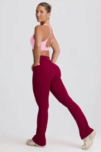 Colanți evazați Soft Active cu talie în V și buzunare, în culoarea Burgundy