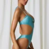 Costum de baie întreg Melo Melo cu decupaje și detalii cu perle, în turcoaz Costum de baie întreg Melo Melo cu decupaje și detalii cu perle, în turcoaz