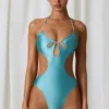 Costum de baie întreg Melo Melo cu decupaje și detalii cu perle, în turcoaz Costum de baie întreg Melo Melo cu decupaje și detalii cu perle, în turcoaz