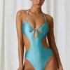 Costum de baie întreg Melo Melo cu decupaje și detalii cu perle, în turcoaz Costum de baie întreg Melo Melo cu decupaje și detalii cu perle, în turcoaz