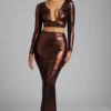 Fustă lungă din jersey metalic Zahra cu talie medie, în nuanța cupru-bronz Fustă lungă din jersey metalic Zahra cu talie medie, în nuanța cupru-bronz