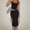 Fustă midi din dantelă Fjolla, cu talie medie și pliuri, în culoarea negru Fustă midi din dantelă Fjolla, cu talie medie și pliuri, în culoarea negru