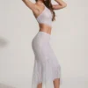 Fustă midi Jordana cu tiv în formă de batistă și ornamente, în culoarea argintiu Fustă midi Jordana cu tiv în formă de batistă și ornamente, în culoarea argintiu