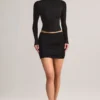 Fustă mini Cali din modal cu volane, talie medie, în negru Fustă mini Cali din modal cu volane, talie medie, în negru
