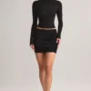 Fustă mini Cali din modal cu volane, talie medie, în negru Fustă mini Cali din modal cu volane, talie medie, în negru