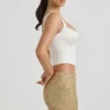 Fustă mini cu talie joasă și ornamente Jianna, în culoarea auriu Fustă mini cu talie joasă și ornamente Jianna, în culoarea auriu