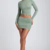 Fustă mini cu talie medie și volane din modal Cali, în culoarea verde salvie Fustă mini cu talie medie și volane din modal Cali, în culoarea verde salvie