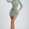 Fustă mini cu talie medie și volane din modal Cali, în culoarea verde salvie Fustă mini cu talie medie și volane din modal Cali, în culoarea verde salvie