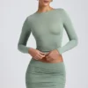 Fustă mini cu talie medie și volane din modal Cali, în culoarea verde salvie Fustă mini cu talie medie și volane din modal Cali, în culoarea verde salvie