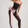 Fustă mini din satin Carola cu detaliu fundă și talie joasă, în culoarea negru Fustă mini din satin Carola cu detaliu fundă și talie joasă, în culoarea negru