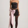 Fustă mini din satin Carola cu detaliu fundă și talie joasă, în culoarea negru Fustă mini din satin Carola cu detaliu fundă și talie joasă, în culoarea negru