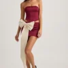 Fustă mini din satin cu detaliu fundă și talie joasă Carola, în culoarea roșu vin Fustă mini din satin cu detaliu fundă și talie joasă Carola, în culoarea roșu vin