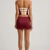 Fustă mini din satin cu detaliu fundă și talie joasă Carola, în culoarea roșu vin Fustă mini din satin cu detaliu fundă și talie joasă Carola, în culoarea roșu vin