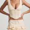 Fustă mini plisată în straturi, cu talie joasă, Lorena, în culoarea fildeș Fustă mini plisată în straturi, cu talie joasă, Lorena, în culoarea fildeș