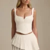 Fustă mini plisată în straturi, cu talie joasă, model Nada, în culoarea Ivory Fustă mini plisată în straturi, cu talie joasă, model Nada, în culoarea Ivory