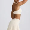 Fustă-pantalon mini din jersey periat, cu talie încrucișată, în culoarea Ivory Marl Fustă-pantalon mini din jersey periat, cu talie încrucișată, în culoarea Ivory Marl