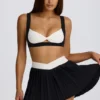 Fustă-pantalon mini plisată Soft Active Crossover în negru Fustă-pantalon mini plisată Soft Active Crossover în negru