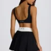 Fustă-pantalon mini plisată Soft Active Crossover în negru Fustă-pantalon mini plisată Soft Active Crossover în negru