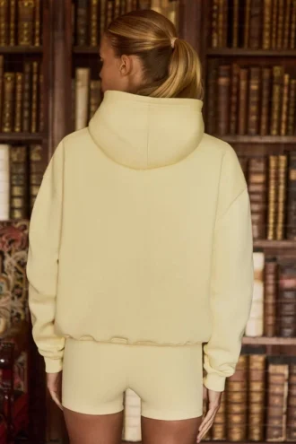 Hanorac oversized brodat în galben deschis
