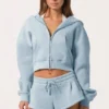 Hanorac oversized cu glugă și fermoar în albastru pudră Hanorac oversized cu glugă și fermoar în albastru pudră