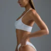 Oh Polly Costume de baie: Top de bikini bandeau cu un umăr, decorat, din ediția HOTFIX, în culoarea alb Oh Polly Costume de baie: Top de bikini bandeau cu un umăr, decorat, din ediția HOTFIX, în culoarea alb