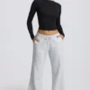 Pantaloni de jogging cu talie joasă și croi larg, în culoarea gri melanj Pantaloni de jogging cu talie joasă și croi larg, în culoarea gri melanj
