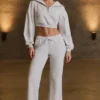 Pantaloni de jogging cu talie joasă și croi larg, în culoarea gri melanj Pantaloni de jogging cu talie joasă și croi larg, în culoarea gri melanj