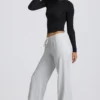 Pantaloni de jogging cu talie joasă și croi larg, în culoarea gri melanj Pantaloni de jogging cu talie joasă și croi larg, în culoarea gri melanj