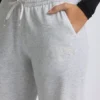 Pantaloni de jogging cu talie joasă și croi larg, în culoarea gri melanj Pantaloni de jogging cu talie joasă și croi larg, în culoarea gri melanj