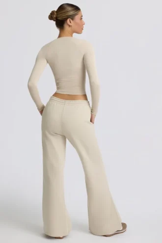 Pantaloni de jogging cu talie joasă și picior larg, în culoarea Bone Pantaloni de jogging cu talie joasă și picior larg, în culoarea Bone
