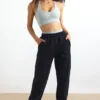 Pantaloni de jogging din bumbac fleece, cu talie medie, în culoarea neagră Pantaloni de jogging din bumbac fleece, cu talie medie, în culoarea neagră