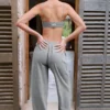 Pantaloni de jogging din bumbac texturat, cu talie joasă și picior larg, în culoarea gri închis Pantaloni de jogging din bumbac texturat, cu talie joasă și picior larg, în culoarea gri închis