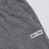 Pantaloni de jogging din bumbac texturat, cu talie joasă și picior larg, în culoarea gri închis Pantaloni de jogging din bumbac texturat, cu talie joasă și picior larg, în culoarea gri închis