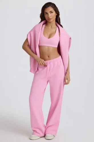 Pantaloni de jogging din jersey de bumbac moale, cu talie medie și croi larg, în roz pal Pantaloni de jogging din jersey de bumbac moale, cu talie medie și croi larg, în roz pal