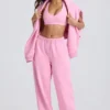 Pantaloni de jogging din jersey de bumbac moale, cu talie medie și croi larg, în roz pal Pantaloni de jogging din jersey de bumbac moale, cu talie medie și croi larg, în roz pal