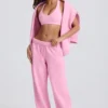 Pantaloni de jogging din jersey de bumbac moale, cu talie medie și croi larg, în roz pal Pantaloni de jogging din jersey de bumbac moale, cu talie medie și croi larg, în roz pal