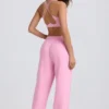 Pantaloni de jogging din jersey de bumbac moale, cu talie medie și croi larg, în roz pal Pantaloni de jogging din jersey de bumbac moale, cu talie medie și croi larg, în roz pal