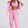 Pantaloni de jogging din jersey de bumbac moale, cu talie medie și croi larg, în roz pal Pantaloni de jogging din jersey de bumbac moale, cu talie medie și croi larg, în roz pal