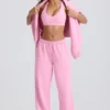 Pantaloni de jogging din jersey de bumbac moale, cu talie medie și croi larg, în roz pal Pantaloni de jogging din jersey de bumbac moale, cu talie medie și croi larg, în roz pal